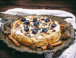 baked round homemade pie with blueberries