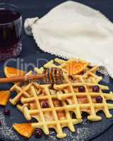 baked Belgian waffles and a glass of juice