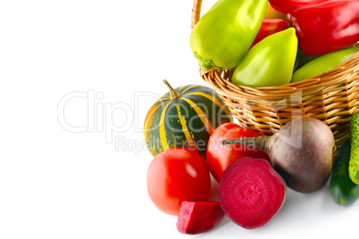 Set of vegetables in wicker basket isolated on white. Free space