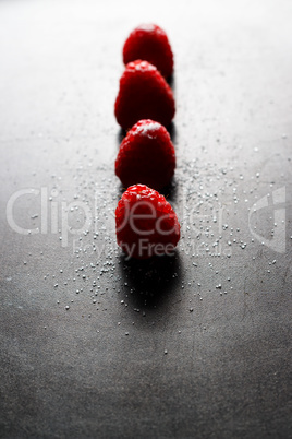 Red raspberries in a row.