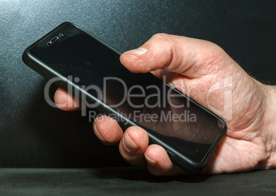 Hand with a mobile phone