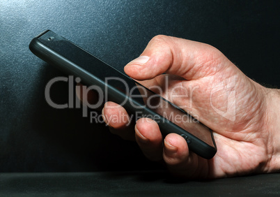 Hand with a mobile phone