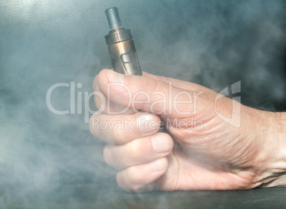 Hand with electronic cigarette