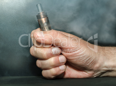 Hand with electronic cigarette