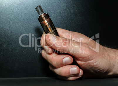 Hand with electronic cigarette
