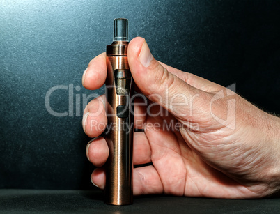 Hand with electronic cigarette