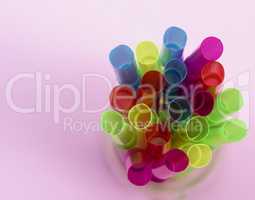 multi-colored plastic tubes for a cocktail