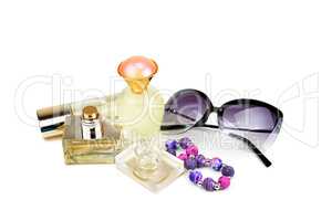 Perfume bottles, sunglasses and bracelet isolated on white backg