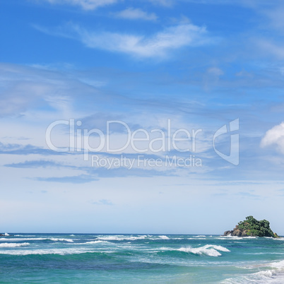 Picturesque beach and blue sky. Coastline of Sri Lanka.