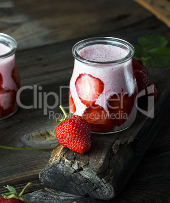 milkshake of fresh strawberries in a glass jar