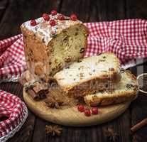 baked big cake with dried fruit and cut into slices