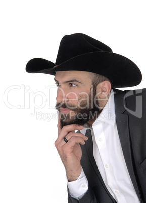 Close-up portrait of man in a suit and cowboy hat