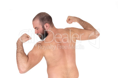 Man standing from back shirtless showing his muscles