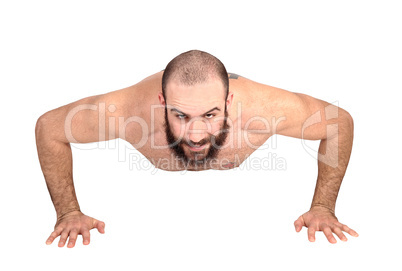 Man with beard doing push ups on the floor