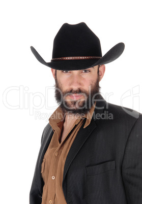 Man in striped jacket and cowboy hat, in a portrait image