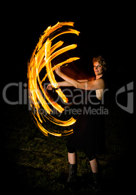 woman shows fire flares in the dark