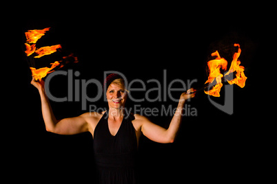 woman holds torches in the dark