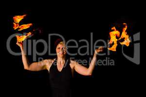 woman holds torches in the dark