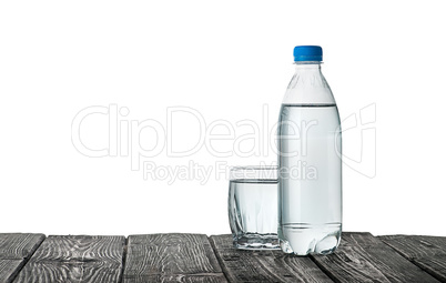 Plastic bottle and a glass with water