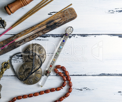 stone rosary and incense sticks