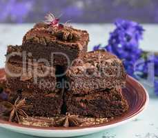 pile of square baked pieces of chocolate Brownie cake