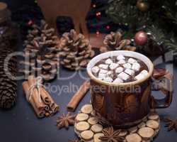 hot chocolate with marshmallow in a brown ceramic mug