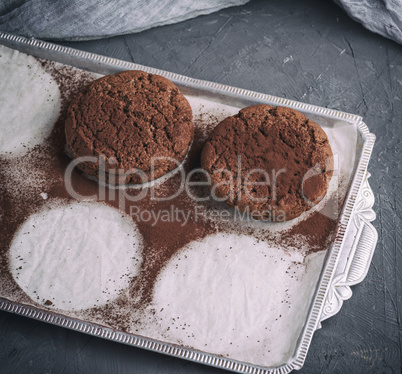 baked round chocolate chip cookies on parchment paper