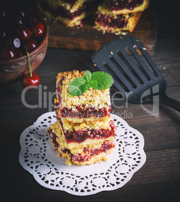 stack of baked crumble cake with cherry