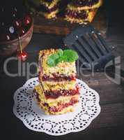 stack of baked crumble cake with cherry