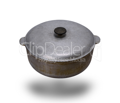 old used aluminum pan with a lid isolated on a white background