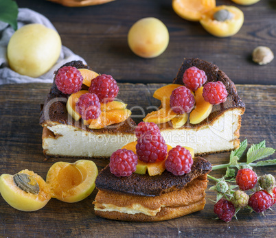 pieces of cottage cheese pie with strawberries and apricots