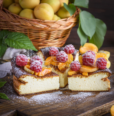 pieces of cottage cheese pie with strawberries and apricots