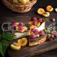 pieces of cottage cheese pie with strawberries and apricots