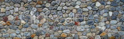 Vintage stone wall panorama background. Close-up