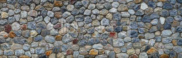 Vintage stone wall panorama background. Close-up
