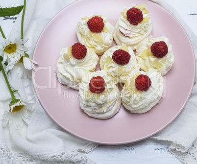 baked meringue with cream and raspberry berries