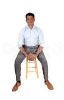 Handsome Asian man sitting on chair
