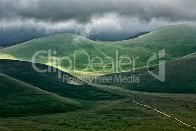 The hills of Castelluccio during a thunderstorm