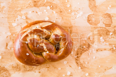 Salty cooked pretzel seen from above