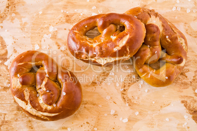 Several salty cooked pretzel seen from above