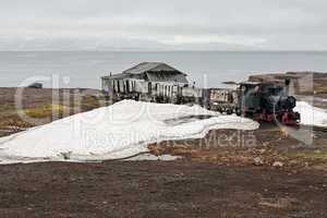 Old industrial train and hut in Ny Alesund, Svalbard islands