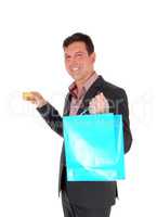 Happy man going shopping with credit card