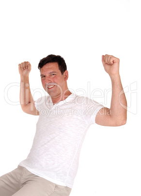 Happy man lifting his fists for excitement