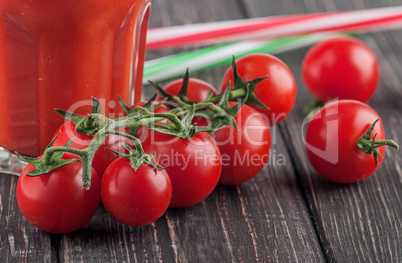 Cherry tomatoes and glass of tomato