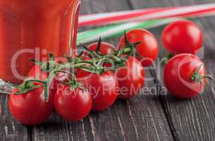 Cherry tomatoes and glass of tomato