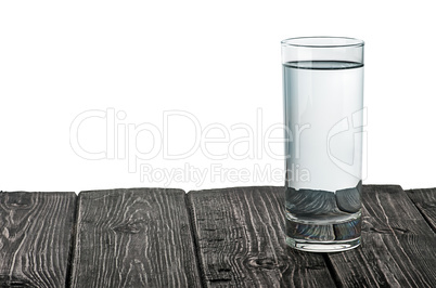 Single glass of water on wooden table