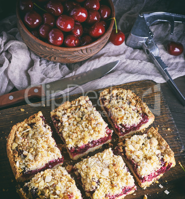 square pieces of cake crumble with cherry