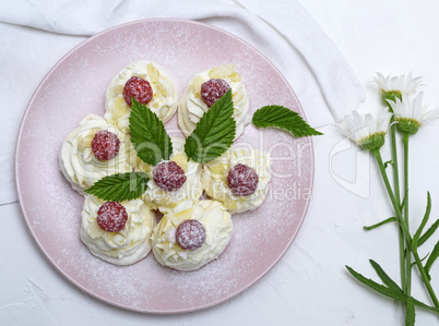 baked cakes made of egg white and whipped white cream with raspb