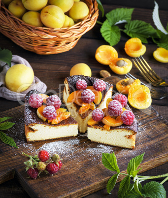 pieces of cottage cheese pie with strawberries and apricots
