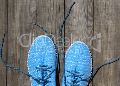 a pair of blue textile shoes